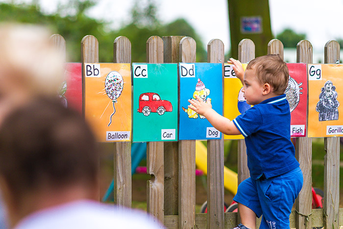 Lower preschool pupil playing and learning