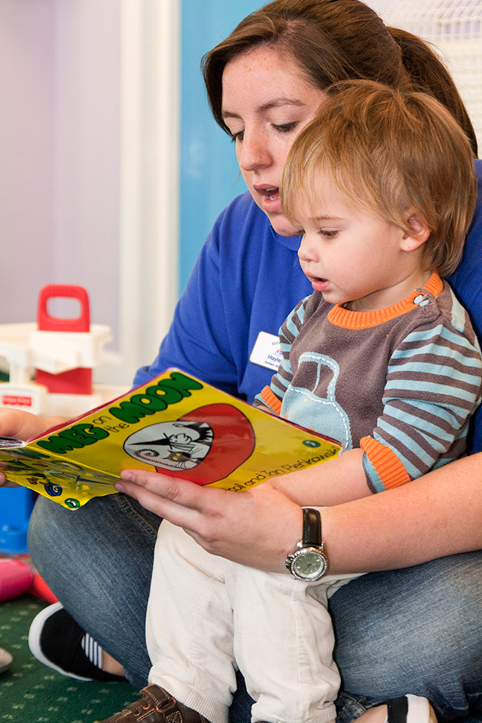Culham Nursery key working helping a toddler to read